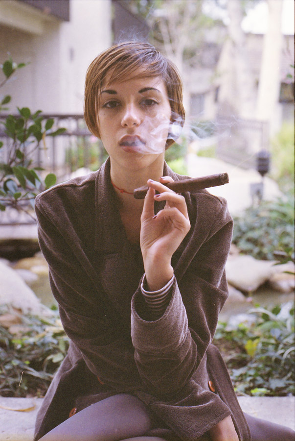 a person standing in front of a rock formation